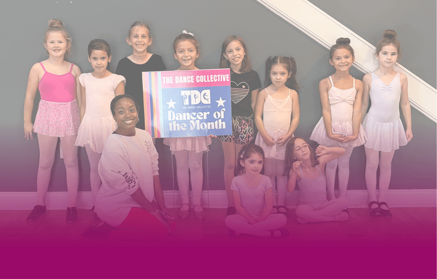 Dancers and their instructor celebrating the Dancer of the Month at The Dance Collective